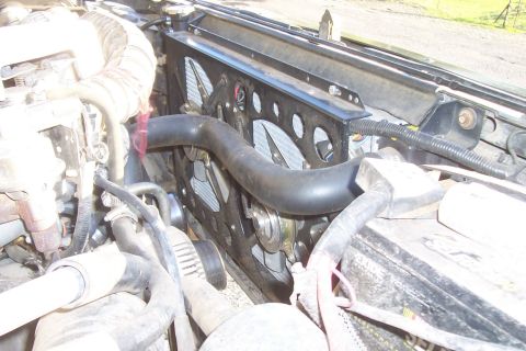 1994 Ford F-150 - Close-up view of a vehicle's radiator and fan assembly.