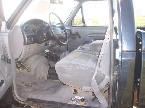 1994 Ford F-150 - Interior view of a 1994 Ford F-150 pickup truck, highlighting the dashboard and seating area.