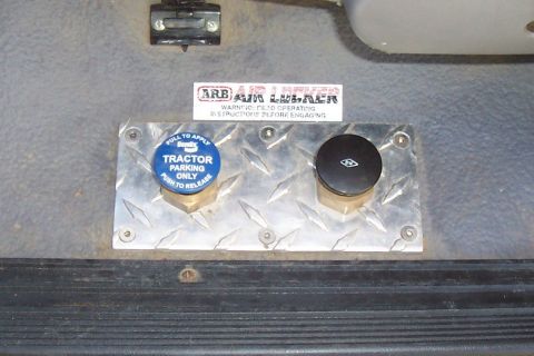 1994 Ford F-150 - Two control knobs are mounted on a diamond plate inside a vehicle, with an ARB Air Locker sticker visible.