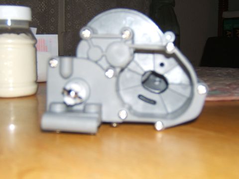1988 Ford Bronco - Close-up view of a gray plastic gear housing, likely a component from a mechanical device.