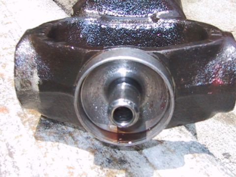 1988 Ford Bronco - This is a close-up view of a vehicle's differential housing, showing a central spindle.