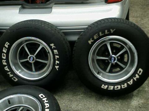 1976 Ford Ranchero - Close-up of two vintage tires and wheels, with brand names visible on the sidewalls.