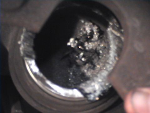1978 Ford Bronco - Corroded brake caliper piston showing significant wear and debris accumulation.