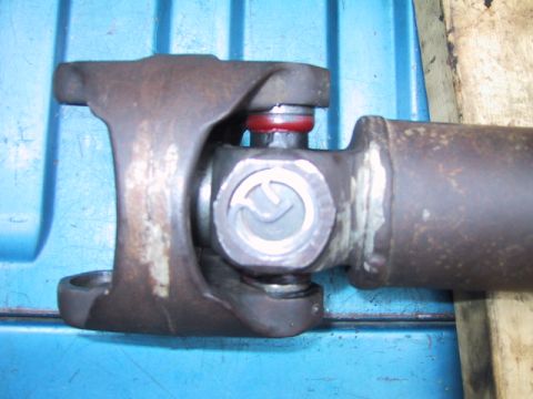 1988 Ford Bronco - Close-up of a driveshaft universal joint, likely needing service.