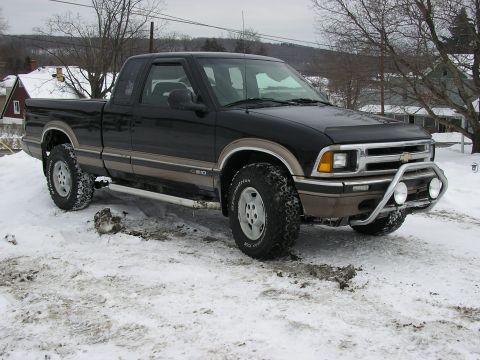 1994 Ford Probe - This black Chevrolet S-10 pickup truck is equipped with a bull bar and fog lights, seen here in a snowy environment.