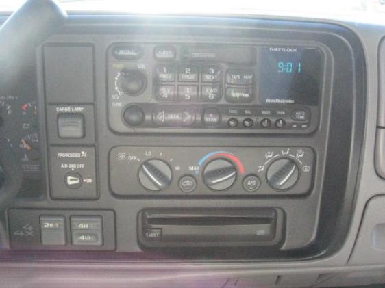 Gray dash center stack with Delco cassette radio, HVAC knobs, 4WD buttons, and air bag off switch