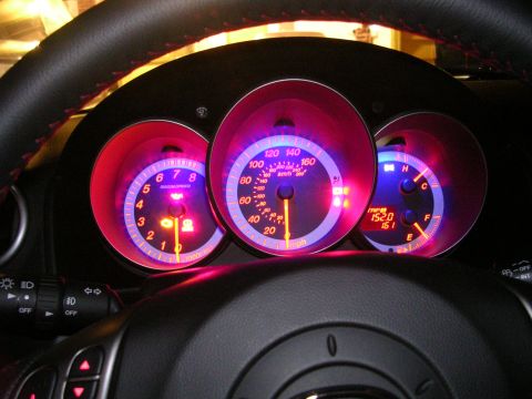2007 Mazda 3 - Dashboard gauges illuminated at night in a 2007 Mazda 3.