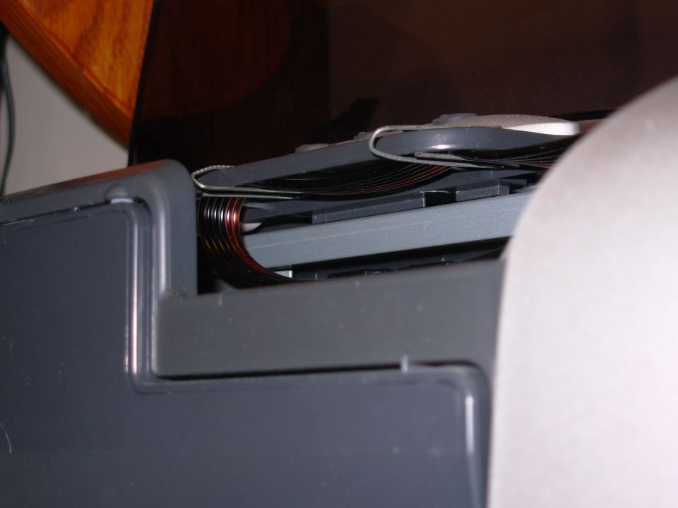 It took some tweaking to get them to sit flat without pinching the tubes, but they're clear of the sliding carriage, and they hold the tubes securely so they curl just like the electronic band at the back.

The only problem is that, as they UNcurl (as the carriage moves to the far LEFT), they tap against the plastic ribs of the case above them.  At first, I thought it sounded like one of the gears was slipping, but it prints perfectly.  I might apply some flock tape later.