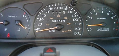 1997 Ford Taurus - The vehicle's dashboard displays the speedometer, tachometer, fuel level, and temperature gauges.