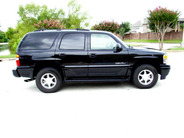 black GMC Yukon Denali parked outside