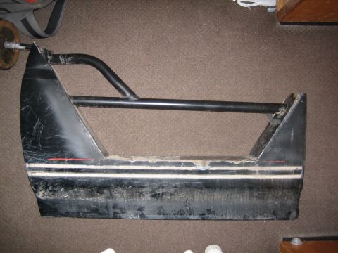 1995 Ford Bronco - A black door with a roll cage attachment is shown, with visible scuffs and stripes.