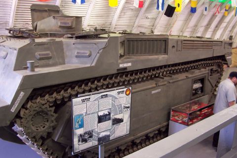 1990 Ford Bronco - A large amphibious vehicle is displayed indoors, with a historical information board detailing battles like Saipan, Guam, and Tinian.