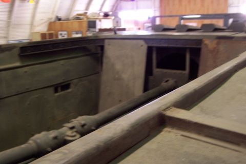 1990 Ford Bronco - Interior view of a military vehicle showing mechanical parts and green painted metal.