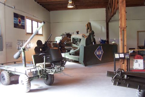 1990 Ford Bronco - Museum exhibits include a towed anti-aircraft gun and a bulldozer on display.