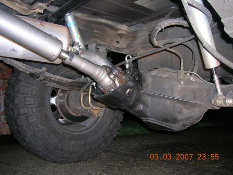 1996 Ford Bronco - Underside view of a 1996 Ford Bronco's rear axle assembly, showing suspension and drivetrain components.