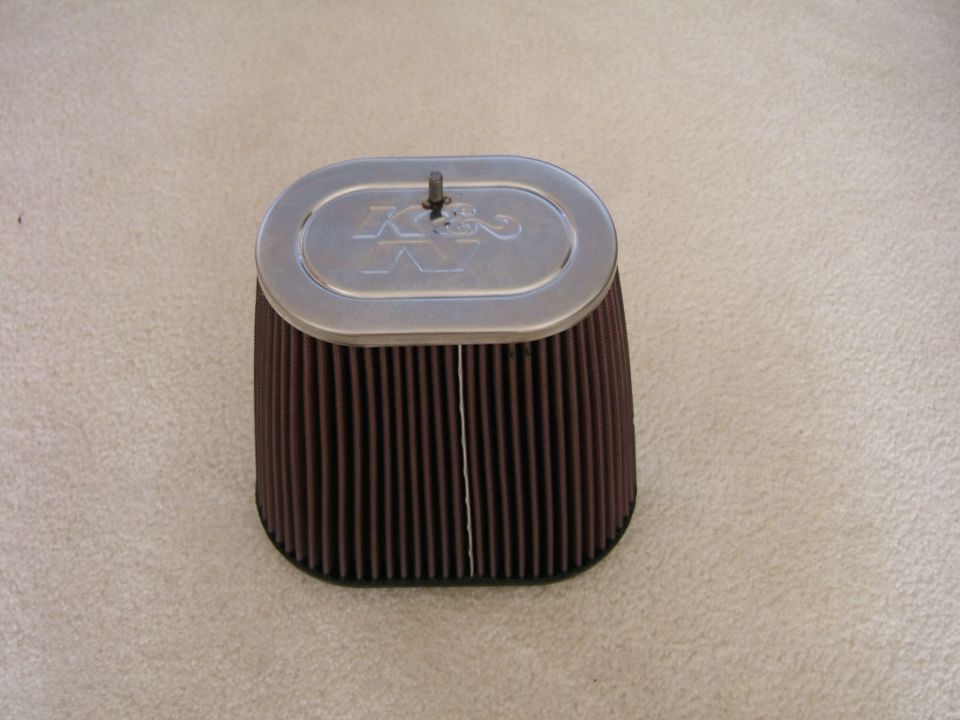 K&N oval cone air filter sitting on carpet