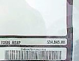 1998 Ford Crown Victoria - Close-up of a document with pricing information and a barcode visible.