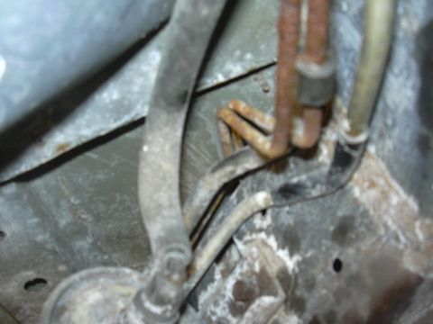 1996 Ford Crown Victoria - Close-up view of brake lines, likely from the undercarriage of a vehicle.