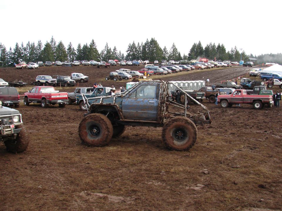 Mud bogging truck with roll cage and large tires