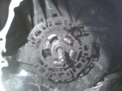1985 Ford Bronco - Close-up view of a vehicle's clutch assembly, showing the pressure plate and springs.