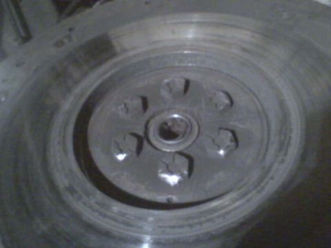 1985 Ford Bronco - Close-up of a clutch flywheel, a component of a vehicle's drivetrain.