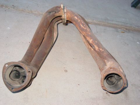 1979 Ford Bronco - This rusty exhaust manifold is a vehicle part, not a 1979 Ford Bronco.