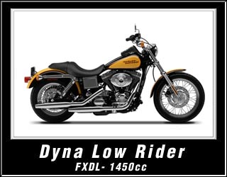 1998 Ford Crown Victoria - A yellow and black Harley-Davidson Dyna Low Rider motorcycle is shown from the side against a white background.
