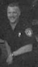 1998 Ford Crown Victoria - A police officer is visible in this black and white photograph.