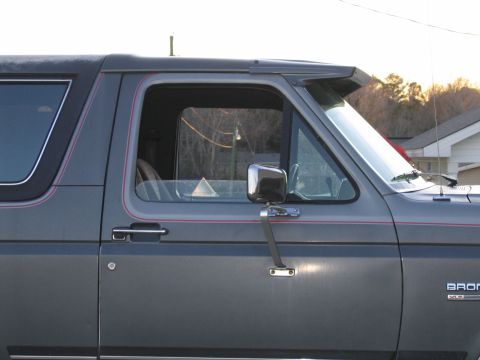 1989 Ford Bronco - The side profile of a 1989 Ford Bronco shows its visor and trim details.