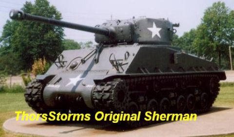 1998 Ford Crown Victoria - A Sherman tank is displayed outdoors with trees in the background.
