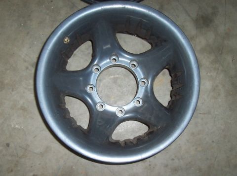 1994 Ford F-150 - This gray alloy wheel features a five-spoke design and a 10-lug bolt pattern, likely for a heavy-duty truck or van.
