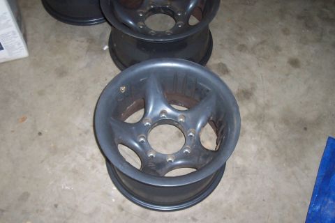 1994 Ford F-150 - Set of aftermarket truck wheels shown on a concrete floor.