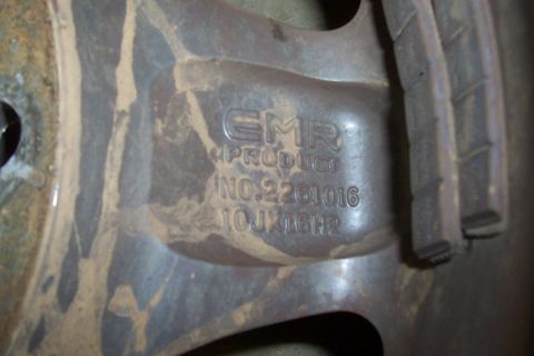 1994 Ford F-150 - Wheel with GMR PRODUCT markings and part number visible.