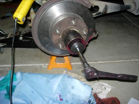 1990 Ford Bronco - Tightening wheel bearings. Inner nut installed and tightened first to 50lbs, then backed off & retightened to 40lbs. Washer inside tab inst…
