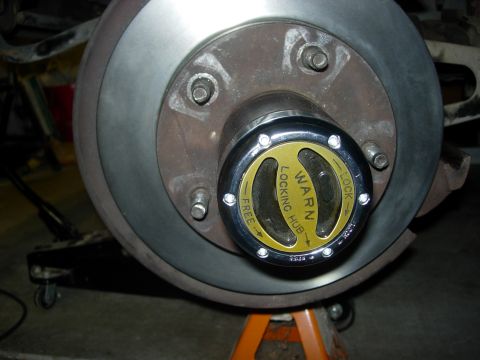 1990 Ford Bronco - Warn Premium manual hub lock replaces factory auto lock.