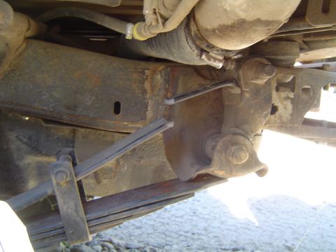 1967 Ford Bronco - Undercarriage view of vehicle frame and suspension components, showing rust and wear.