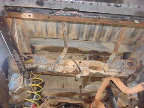 1983 Ford Bronco - this is the hole where the fuel tank was. i need to clean it up and hit it with some paint.