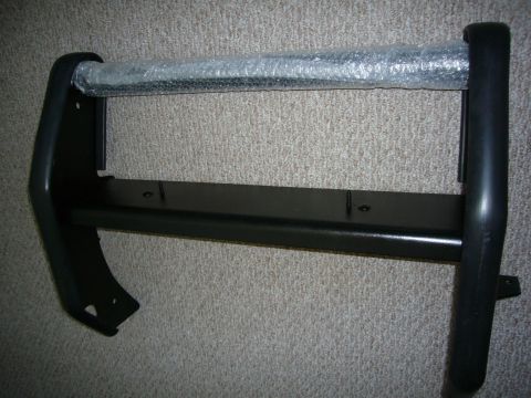 2000 Ford Crown Victoria - Black bull bar, likely for a police or utility vehicle, shown with protective bubble wrap on the upper crossbar.