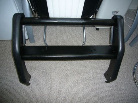 2000 Ford Crown Victoria - Bull bar part for a vehicle, shown indoors on a carpeted floor.