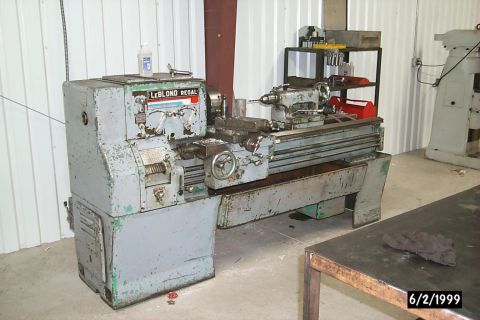 1965 Ford Mustang - A LeBlond Regal lathe is shown in a workshop setting, with another machine visible in the background.