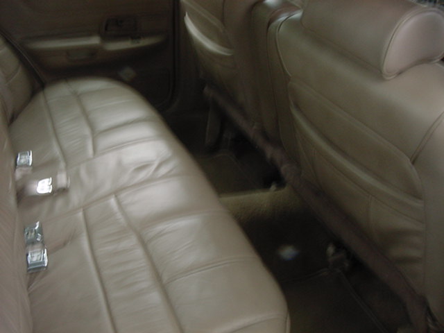 1992 Ford Crown Victoria interior with tan leather seats and door panel