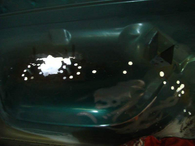1996 Ford Bronco interior floor with holes drilled for rust repair