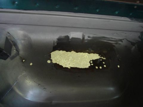 1996 Ford Bronco - This photo shows a section of a vehicle's floor undergoing repair for rust damage.