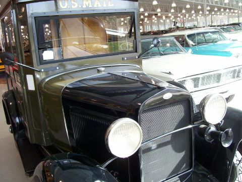 1996 Ford Bronco - A vintage U.S. MAIL truck is parked in front of other vehicles.