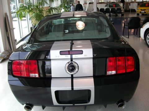 1996 Ford Bronco - This black Ford Mustang Shelby GT500 features silver racing stripes and a GT500 emblem on the rear.