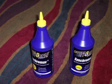 2003 Ford Focus - Two bottles of Royal Purple Synchromax manual transmission fluid are shown on a carpeted surface.