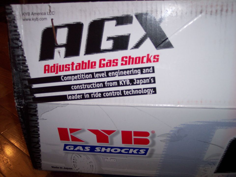 Box for KYB AGX Adjustable Gas Shocks, with text about competition level engineering and construction from KYB, Japan