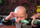 1979 Ford Bronco - A child is being poured a drink from a green bottle.