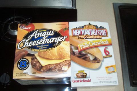 1994 Ford F-150 - Boxes of frozen Angus Cheeseburgers and Philly Cheesesteak sandwiches are displayed on a counter.