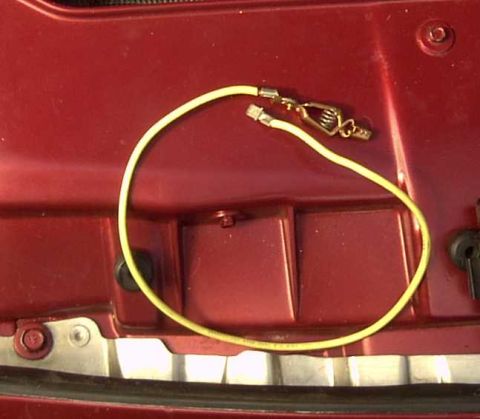 1997 Ford Taurus - Close-up of a yellow automotive wire with connectors, likely a jumper or diagnostic lead.